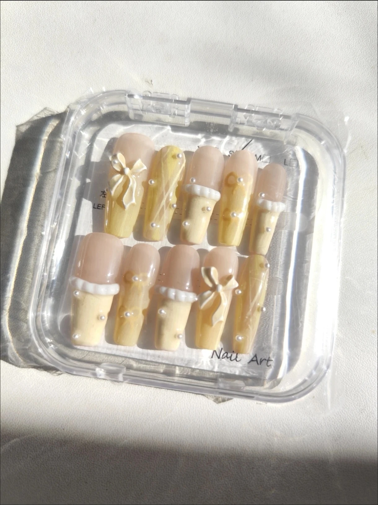 N022 Cute Pastel Yellow Long Coffin Press-On Nails with Bow Details - Image 2